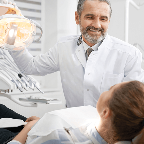 Dentist Smiling with Patient