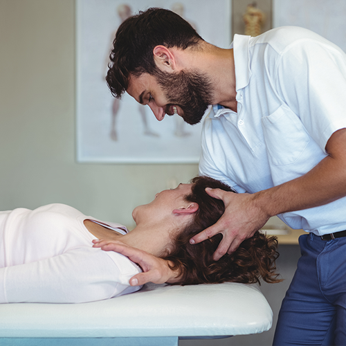 Osteopath treating patient