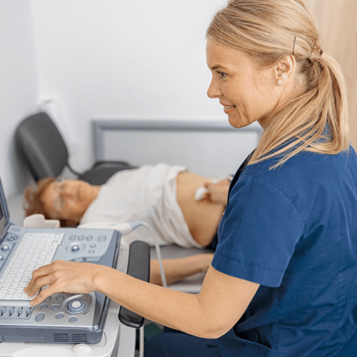 Sonographer performing ultrasound